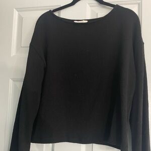 Black size medium sweater with bell sleeves.